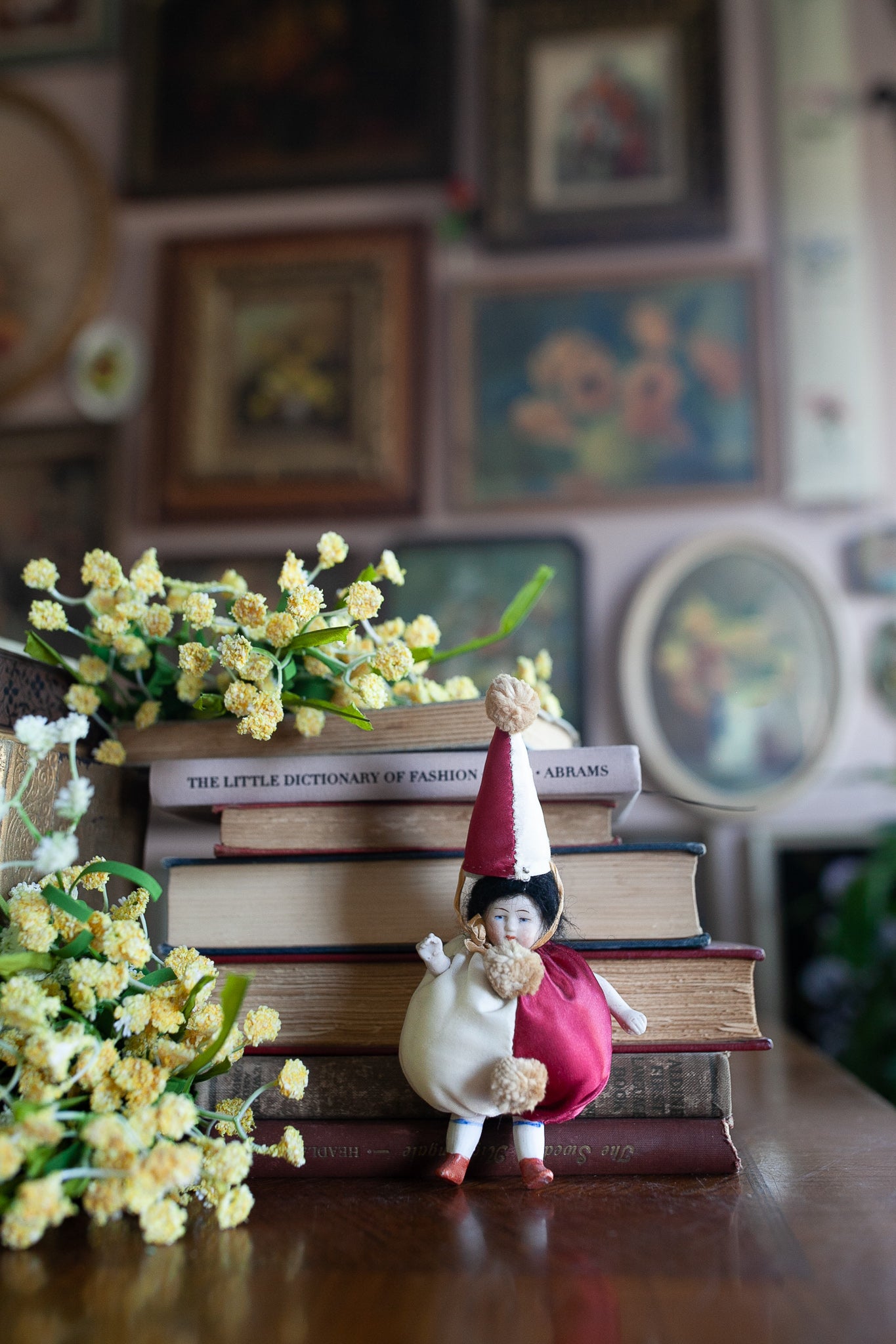 Antique German All Bisque Doll - Dressed in a silk Clown Suit