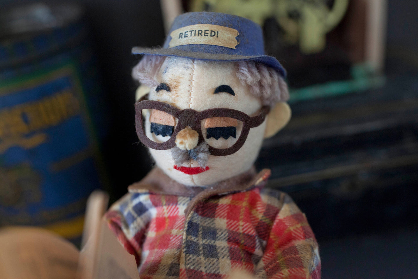 Vintage Retired Man Doll in a Wicker Chair