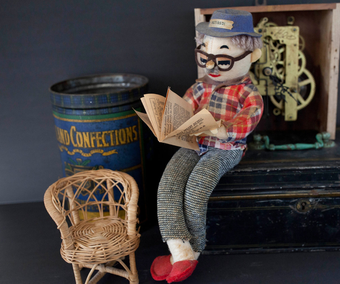 Vintage Retired Man Doll in a Wicker Chair